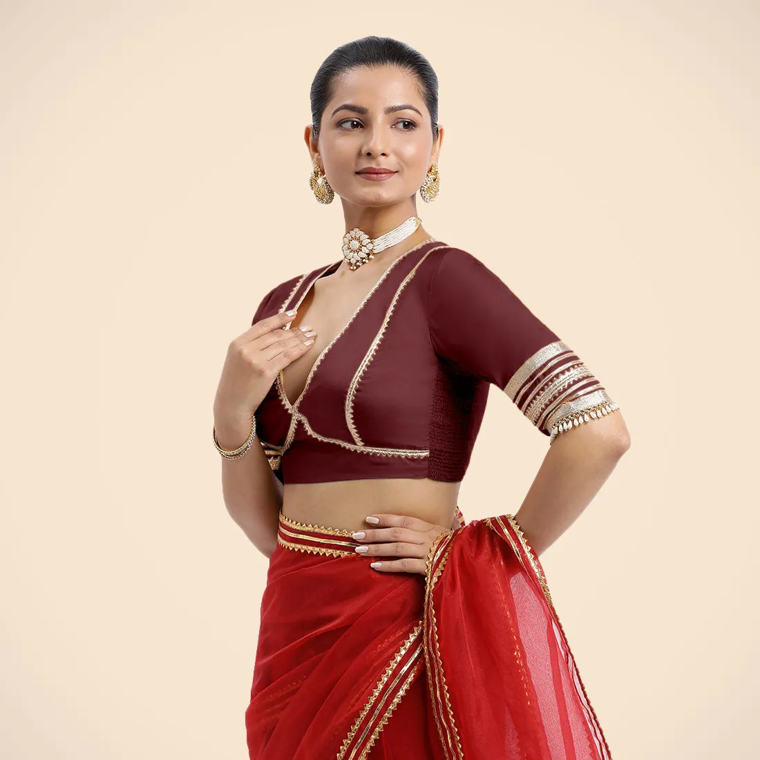 Nafeeza x Tyohaar | Burgundy Embellished Elbow Sleeves FlexiFit™ Saree Blouse with Plunging V Neckline with Tasteful Golden Gota Lace