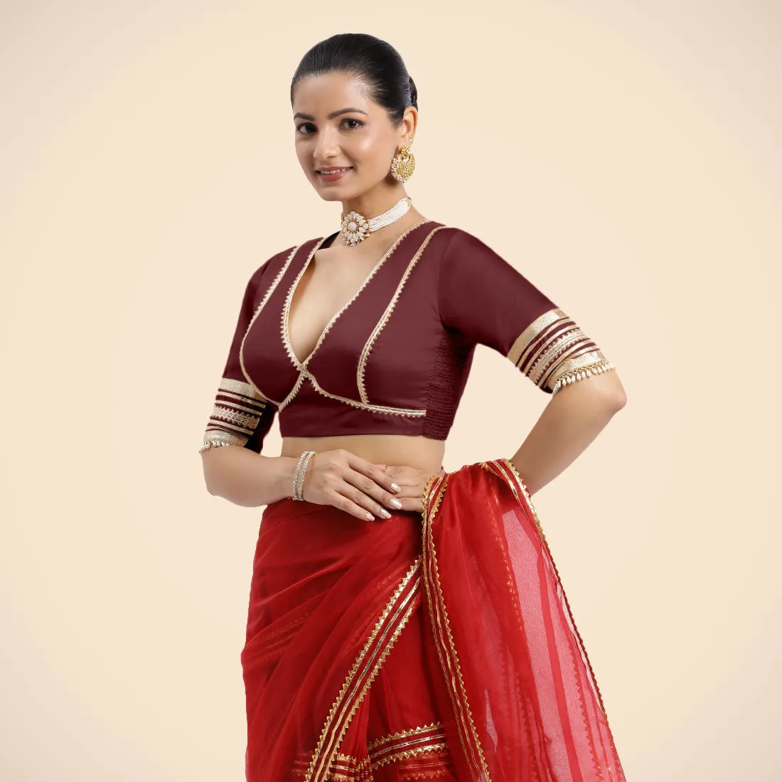 Nafeeza x Tyohaar | Burgundy Embellished Elbow Sleeves FlexiFit™ Saree Blouse with Plunging V Neckline with Tasteful Golden Gota Lace
